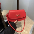 Chic red semi-circular crossbody bag with golden bow metallic buckle detail - Red