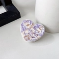 Detailed top view of a heart-shaped phone socket with purple marble texture on a white base - Purple