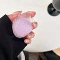 Close-up of translucent purple strawberry phone grip on a hand with matte finish details - Purple