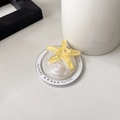 Macro shot of yellow resin starfish phone grip with glitter and Gift For You engraving - Magnetic Round Pearlescent Starfish / Yellow