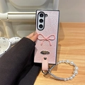 Pink pleated leather folding phone case with bow decoration and pearl wrist strap - Pink (3D Bow + Pearl Chain) / Samsung ZFlip3