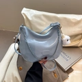 Light blue patent leather crescent bag with silver chain and white plush puppy charm - With Charm / Blue
