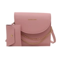 Pink crossbody bag with gold chain and matching mini pouch on white background - Pink