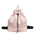 Pink drawstring backpack with black bow pattern and adjustable nylon straps - Pink