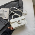 Elegant white quilted handbag with a gold clover clasp and adjustable shoulder strap - Off White