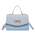 Light blue contrast crossbody bag with V-quilted pattern and gold bow accent - Blue