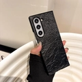 Detail of black faux leather phone case with crinkled texture for foldable smartphones - Black / Samsung ZFlip3