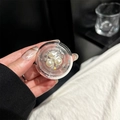 Detailed view of clear phone socket featuring elegant white pearls and sparkling rhinestones - Adhesive Round Three Pearl Flower