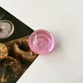 Detail of pink translucent dome phone grip with a glossy crystal ball effect for smartphones - Transparent Pink