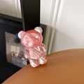 Close-up detail of a pink textured bear phone grip with pearl finish resin texture - Water Ripple Bear (Translucent Red)