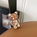 Detailed view of a brown textured bear-shaped expandable phone socket grip - Water Ripple Bear (Translucent Brown)