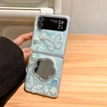 Close-up detail of light blue glittery foldable phone case with rhinestone mirror - Blue - Polka Dot Butterfly Flower Mirror / Samsung ZFlip3