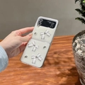 Detail of luxury creamy white case with 3D bows and rhinestones for Galaxy Z Flip - Matte Hard Shell-White Glitter Drip-Rhinestone White Bow / Samsung ZFlip3