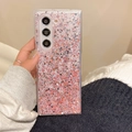 Detail of pink gradient glitter phone case with holographic sequins held in hand - Red / Z Flip 3