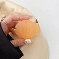 Macro shot of an orange fish-shaped phone grip with creative translucent resin texture - Matte Light Jelly Orange