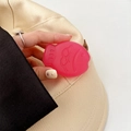 Close-up of pink fish-shaped phone grip held in hand showing compact silicone design - Matte Light Jelly Rose Red