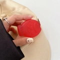 Close-up of red fish-shaped silicone expanding phone grip with detailed embossed texture - Matte Light Jelly Red