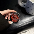 Close-up of translucent red cat paw phone stand with Good Luck engraving and heart detail - Blue Light Matte Magnetic Cat Claw / Dazzling Brown