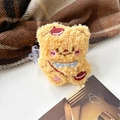 Close-up of ginger plush bear hair claw with red beret and soft fleece texture - Cream Messenger Rope Back Clip