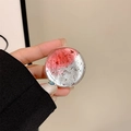 Detail of a transparent phone grip with red and silver foil gradient texture in hand - Gradient Red