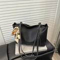 Detail of black tote bag with white stitching and decorative vintage pattern silk scarf - Black