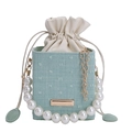 Mint green textured bucket bag with oversized pearl handle and gold chain strap - Green