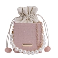 Pink drawstring bucket bag with pearl handle and metal chain for women's crossbody wear - Pink