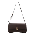 Minimalist dark brown leather shoulder bag with a stylish gold oval metal lock - Brown