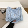 Light blue quilted shoulder bag with diamond star embellishment and silver chain strap - Blue