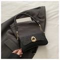 Detail of sequin flap and golden horseshoe buckle on black leather shoulder bag - Black