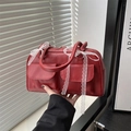 Deep red vintage Boston bag with matte leather finish and white lace bow detail - Red