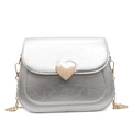 Metallic silver crossbody flap bag with golden heart lock and elegant chain strap - Silver