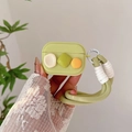Detail of light green silicone AirPods case with thick braided lanyard and geometric blocks - AirPods 1/2 Gen / Green