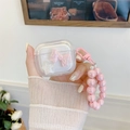 Klare AirPods-Hülle mit rosa Schleife, Glitzerstern und Perlenarmband-Tragegurt - Magische Rosa Schleife Stern (Mit Perlenarmband) / Für Airpods Gen 1/2