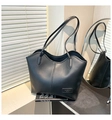 Detail of minimalist black tote bag with fashion bags label and sleek leather texture - Black