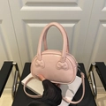 Pink semi-circle handbag with embossed bow designs and adjustable crossbody strap - Without Scarf / Pink