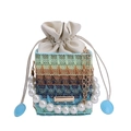 Colorful woven straw bucket bag with pearl handle, drawstring closure and chain strap - Light Blue