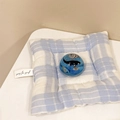 Detail of blue ocean resin ball with whale and shell on a blue checkered cushion - Crystal Ball Stand Style - Black Fish (900007)