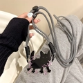 Detail of adjustable black and white braided crossbody phone strap with cat acrylic pendant - (Set) Curvy Cat - Black Braided Rope
