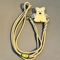 Detail of adjustable crossbody phone strap with cute Westie dog clip and smiley patch - No.2 Large Yellow Sitting Dog - Woven Rope