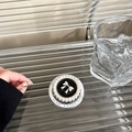 Detail of magnetic phone grip with pearl border and silver bow on black enamel base - Black Pearl Bow Magnetic Style