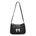 Chic black leather handbag with a bow detail and silver accent for women - Black