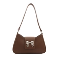 Classic dark brown baguette bag with a silver metal bow accent on a clean white background - Brown