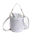 Chic white bucket bag with embossed texture and gold hardware for crossbody wear - White