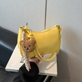 Bright yellow crescent crossbody bag with plush bear charm and knotted shoulder strap - With Pendant / Yellow