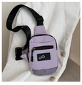 Close-up of lavender nylon mini chest bag with adjustable strap and mesh detail - Purple