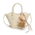 Chic cream woven bucket bag with top handles, long strap, and cute plush bear charm - With Pendant / White