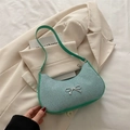 Chic mint green crescent shoulder bag with silver bow accent and glitter fabric finish - Green