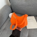 Vibrant orange felt hobo handbag with elegant gold chain strap and white fur ball - Orange