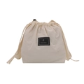 Minimalist beige drawstring bucket bag with black brand patch for casual summer style - White
